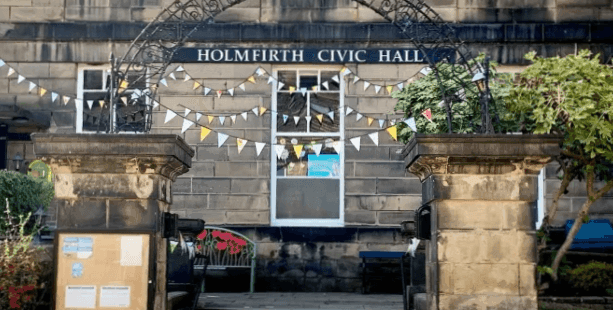 Holmfirth civic hall with bunting outside